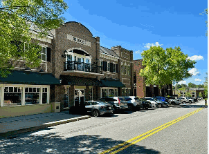 Commercial building in North Atlanta Metro with parked cars, showing an HVAC company service.